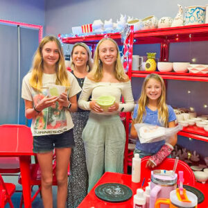 Ceramic art studio Hot Spot customers show off art projects.