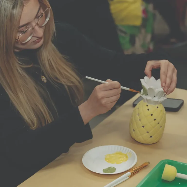 Hand Painting Pottery Pineapple Design At The Hot Spot In Pflugerville, TX.